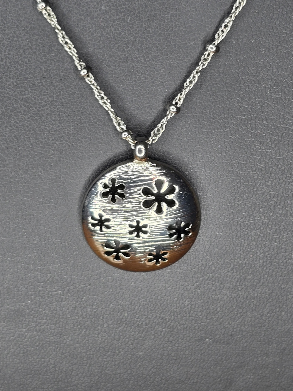 Lia Sophia Silver Floral Cutout Round Pendant Necklace